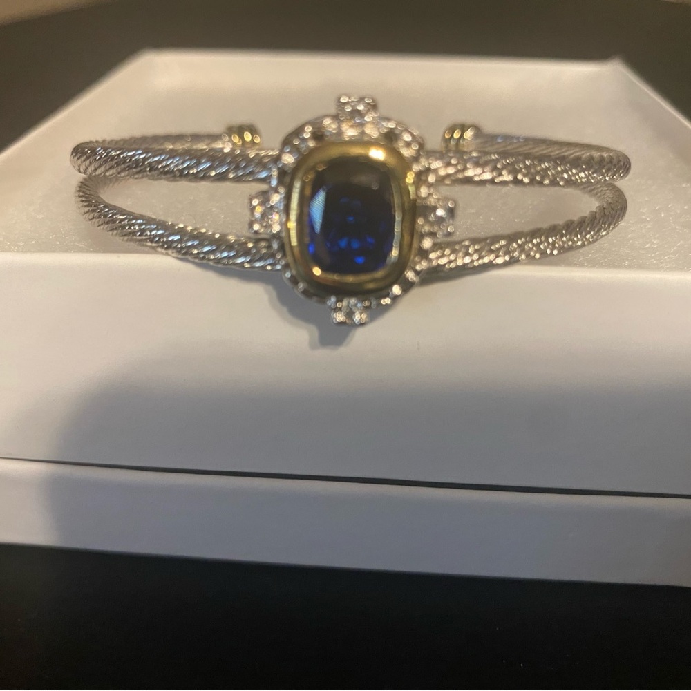 Sophisticated Silver and Gold Bracelet with Deep Blue Accent